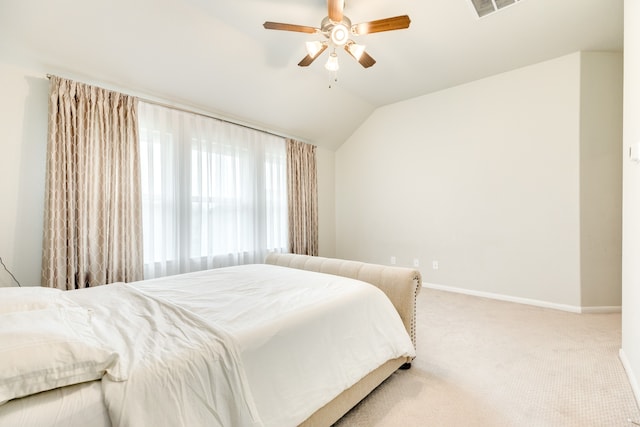 carpeted bedroom featuring lofted ceiling and ceiling fan