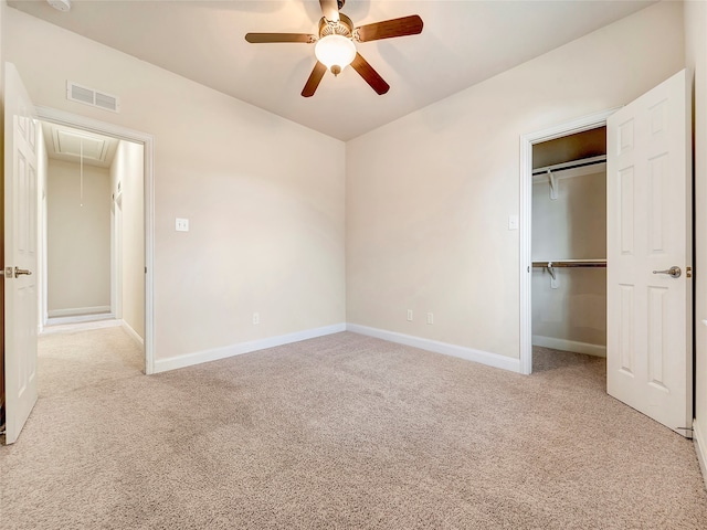 unfurnished bedroom featuring light carpet and ceiling fan