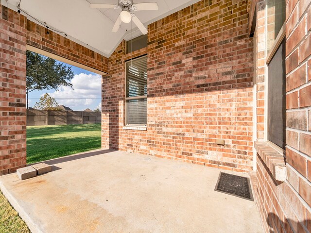 view of patio / terrace featuring ceiling fan