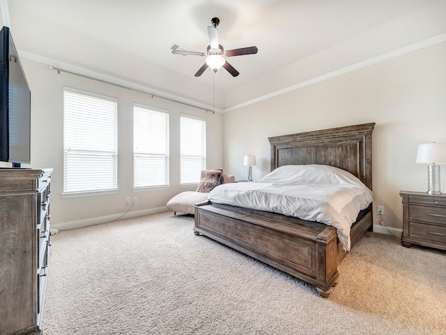 bedroom featuring light carpet, ceiling fan, and crown molding