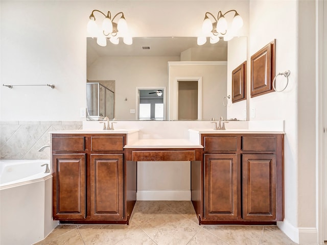 bathroom featuring tile patterned floors, vanity, shower with separate bathtub, and an inviting chandelier