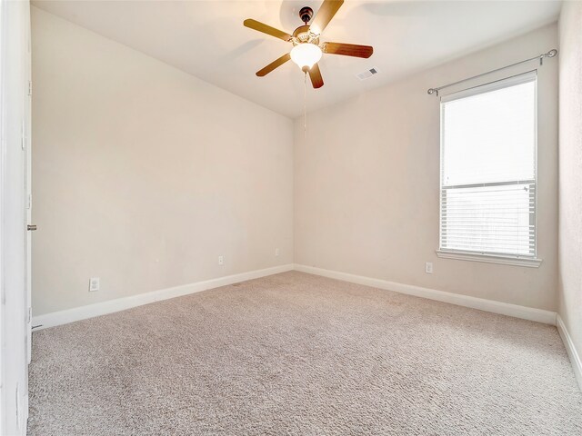 unfurnished room featuring carpet floors and ceiling fan