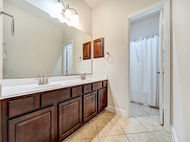 bathroom with vanity, a shower with shower curtain, and tile patterned floors