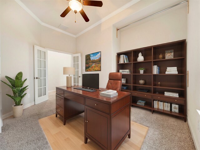 office with ceiling fan, french doors, and crown molding