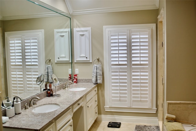 bathroom with vanity, crown molding, and tile patterned flooring