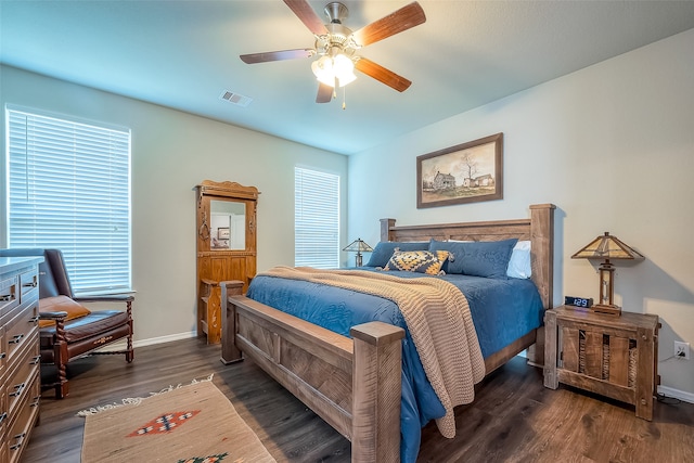 bedroom featuring dark hardwood / wood-style floors and ceiling fan