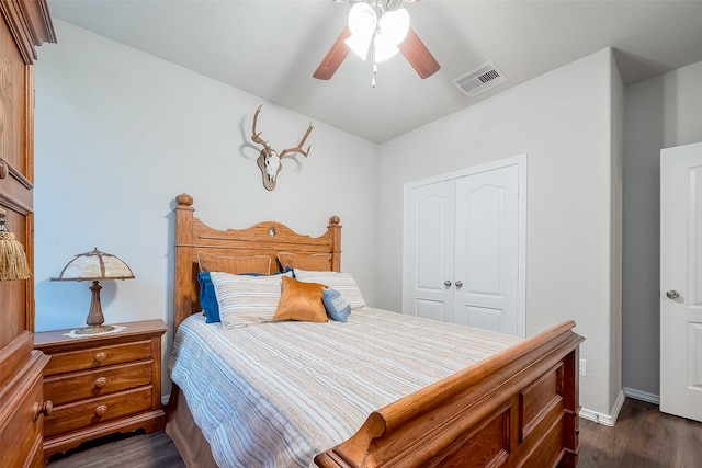 bedroom with ceiling fan, a closet, and dark hardwood / wood-style flooring