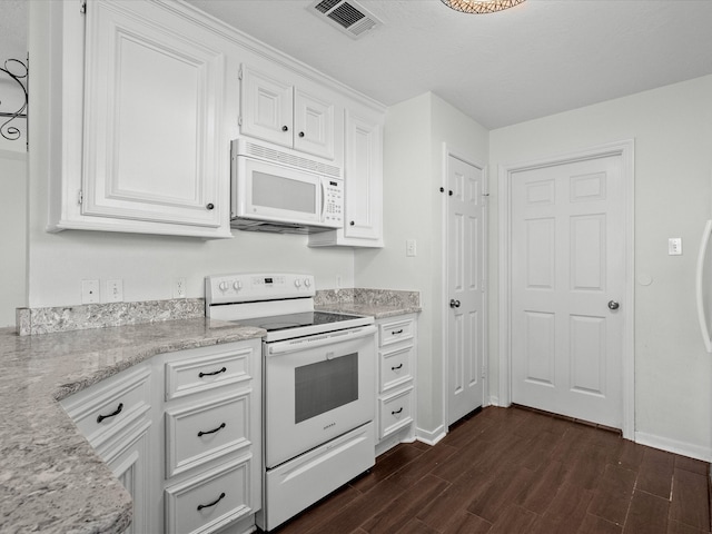 kitchen featuring white cabinets, light stone countertops, dark hardwood / wood-style floors, and white appliances