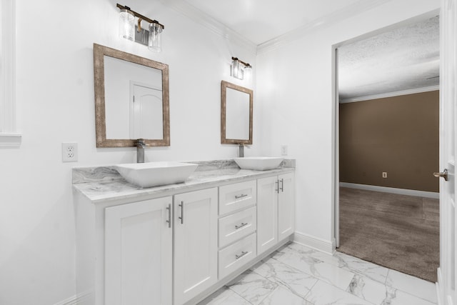 bathroom with vanity, ornamental molding, and a textured ceiling