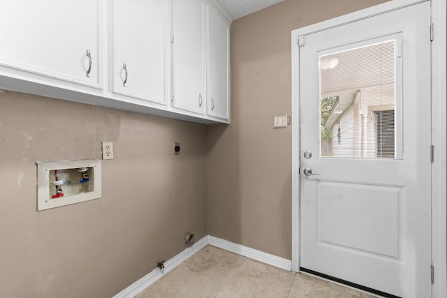 laundry room featuring cabinets, hookup for a washing machine, light tile patterned floors, and electric dryer hookup