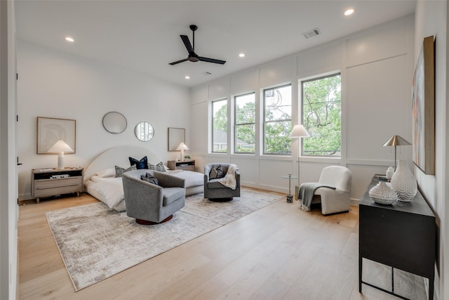 bedroom with ceiling fan and light hardwood / wood-style floors