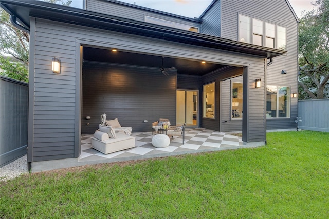 rear view of house with a yard and a patio