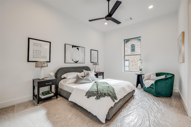 bedroom featuring ceiling fan and carpet