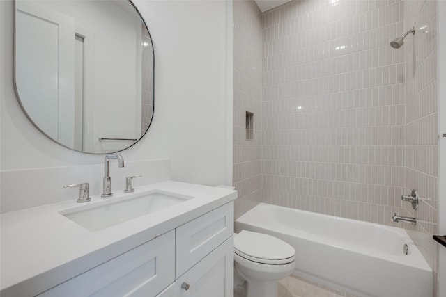 full bathroom featuring vanity, toilet, and tiled shower / bath