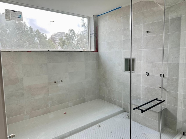 bathroom with tiled shower