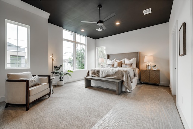 bedroom featuring visible vents, baseboards, carpet, recessed lighting, and a ceiling fan