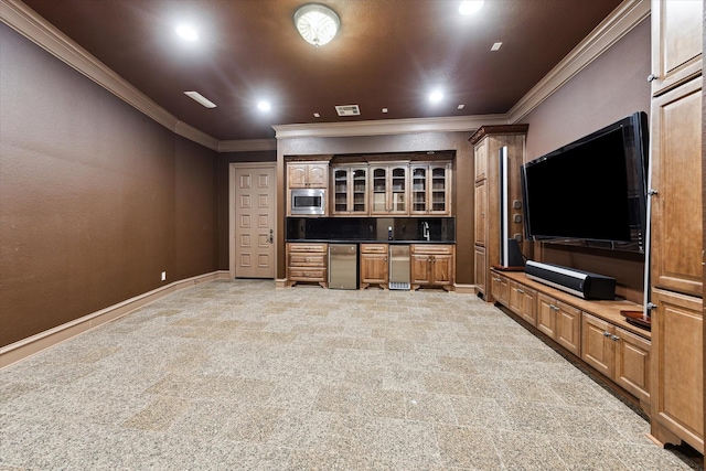 interior space with stainless steel microwave, refrigerator, and crown molding