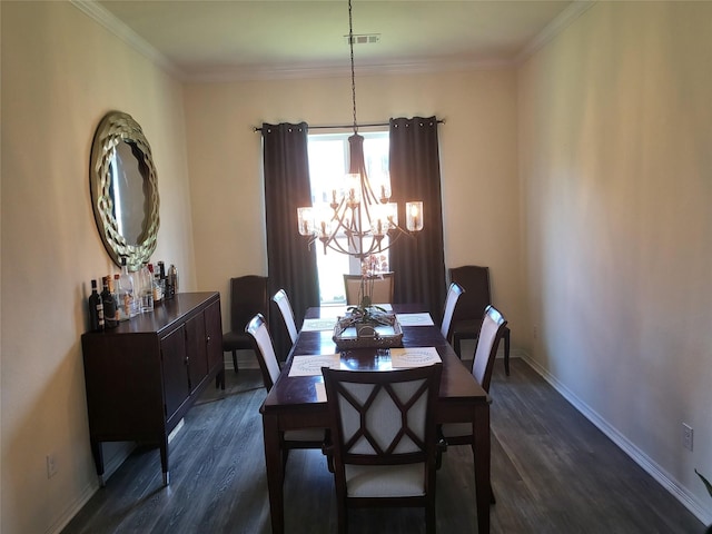 dining space featuring ornamental molding, dark hardwood / wood-style flooring, and a chandelier