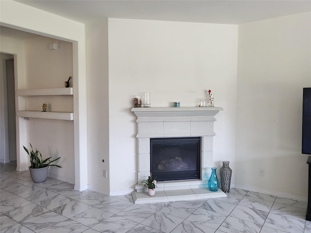 unfurnished living room featuring a tiled fireplace