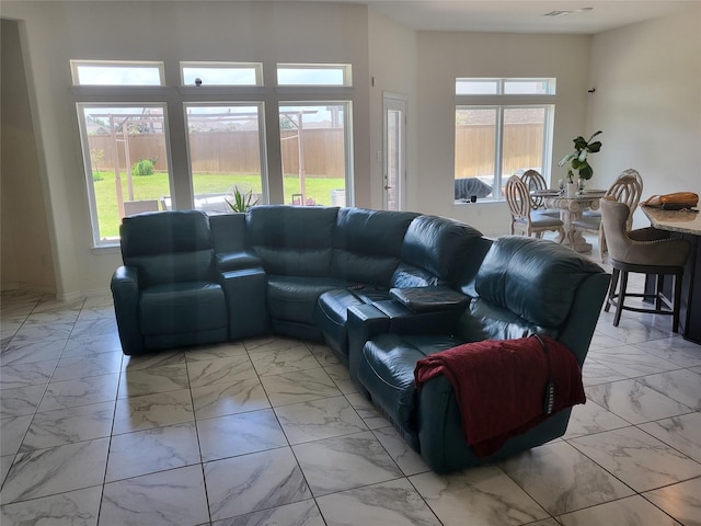 living room featuring plenty of natural light