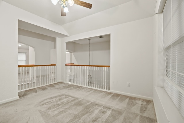 empty room with carpet and ceiling fan