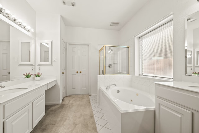 bathroom with vanity, shower with separate bathtub, and tile patterned flooring