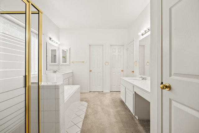 bathroom featuring vanity and a bathing tub