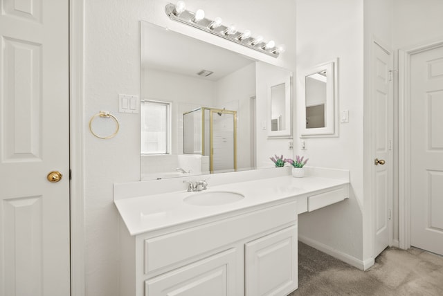 bathroom with vanity and an enclosed shower