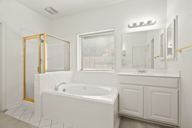 bathroom featuring vanity, plus walk in shower, and tile patterned flooring