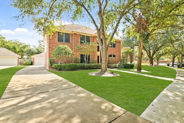 view of front of property featuring a front lawn and a garage