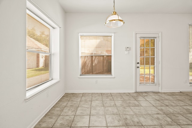 unfurnished dining area with a healthy amount of sunlight