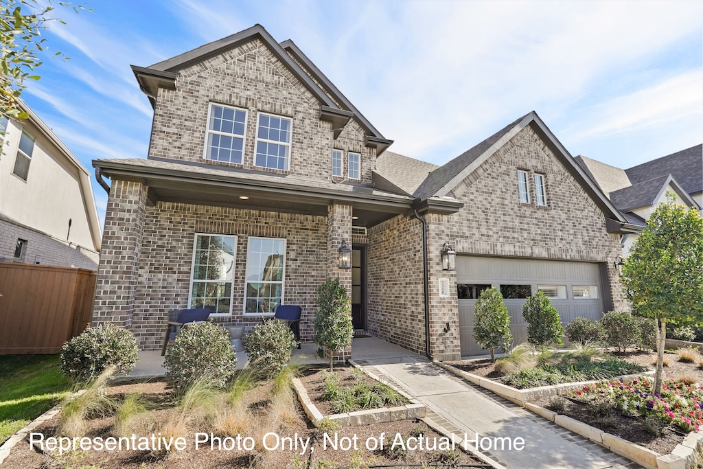 view of front of house with a porch and a garage