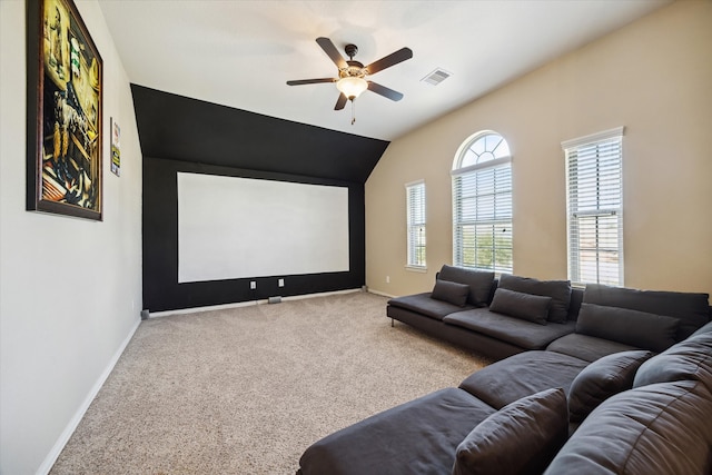 home theater room with ceiling fan, carpet, and lofted ceiling