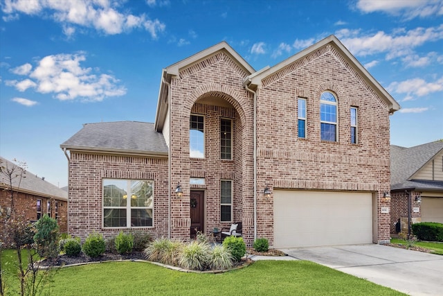 front of property featuring a front yard and a garage