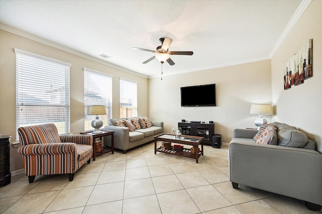 living room featuring ceiling fan, ornamental molding, and light tile patterned floors