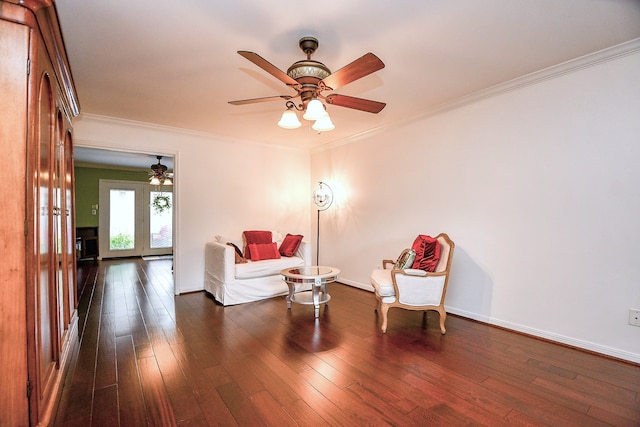 living area featuring ceiling fan, ornamental molding, and dark hardwood / wood-style flooring