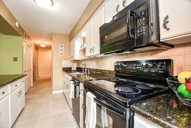 kitchen featuring tasteful backsplash, light tile patterned floors, white cabinetry, black appliances, and sink