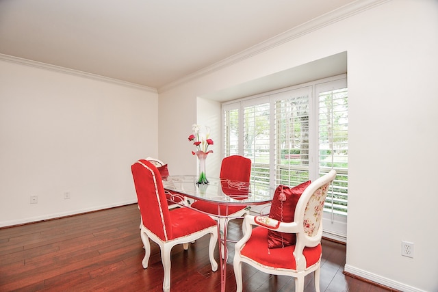 dining area with ornamental molding and dark hardwood / wood-style floors