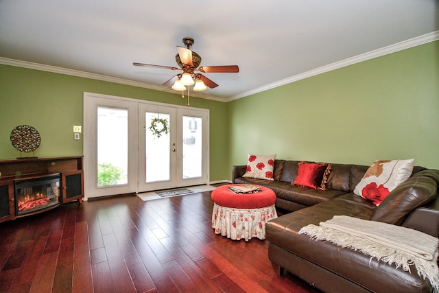 living room featuring ceiling fan, ornamental molding, and dark hardwood / wood-style floors