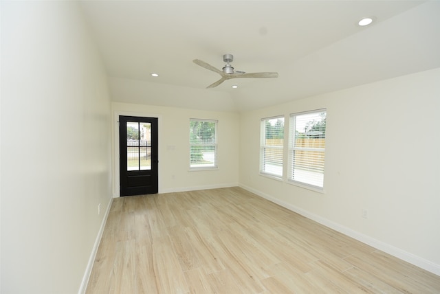 spare room with light hardwood / wood-style floors and ceiling fan