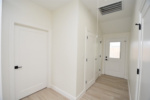 corridor featuring light hardwood / wood-style flooring