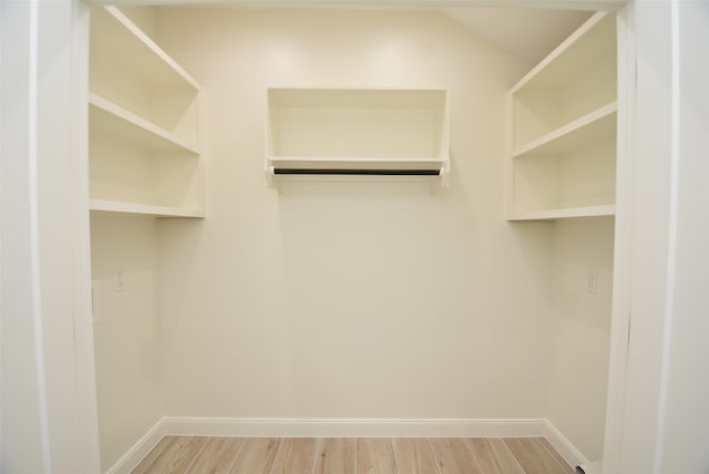 spacious closet with wood-type flooring