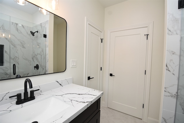 bathroom featuring vanity and an enclosed shower