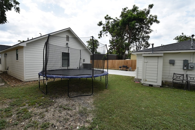 view of yard with a trampoline