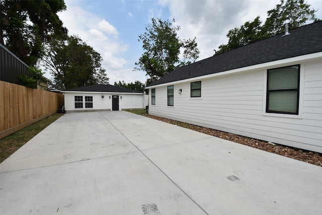 view of property exterior with a patio