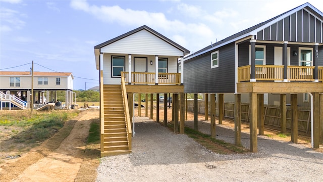 view of front of home featuring covered porch and a carport