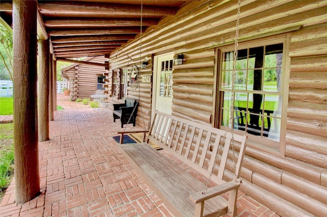 view of patio featuring a porch