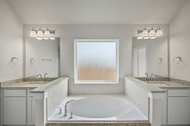 bathroom with vanity and a bathtub