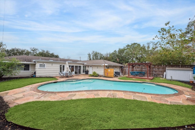 view of swimming pool with a pergola, a patio area, and a lawn