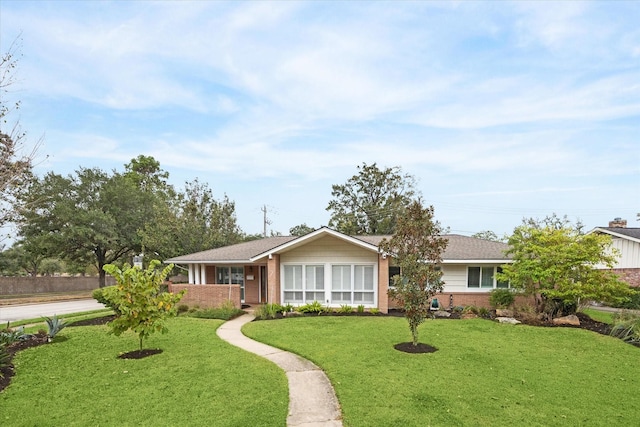 single story home with a front yard